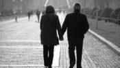 man-and-woman-walking-on-sidewalk-3638157